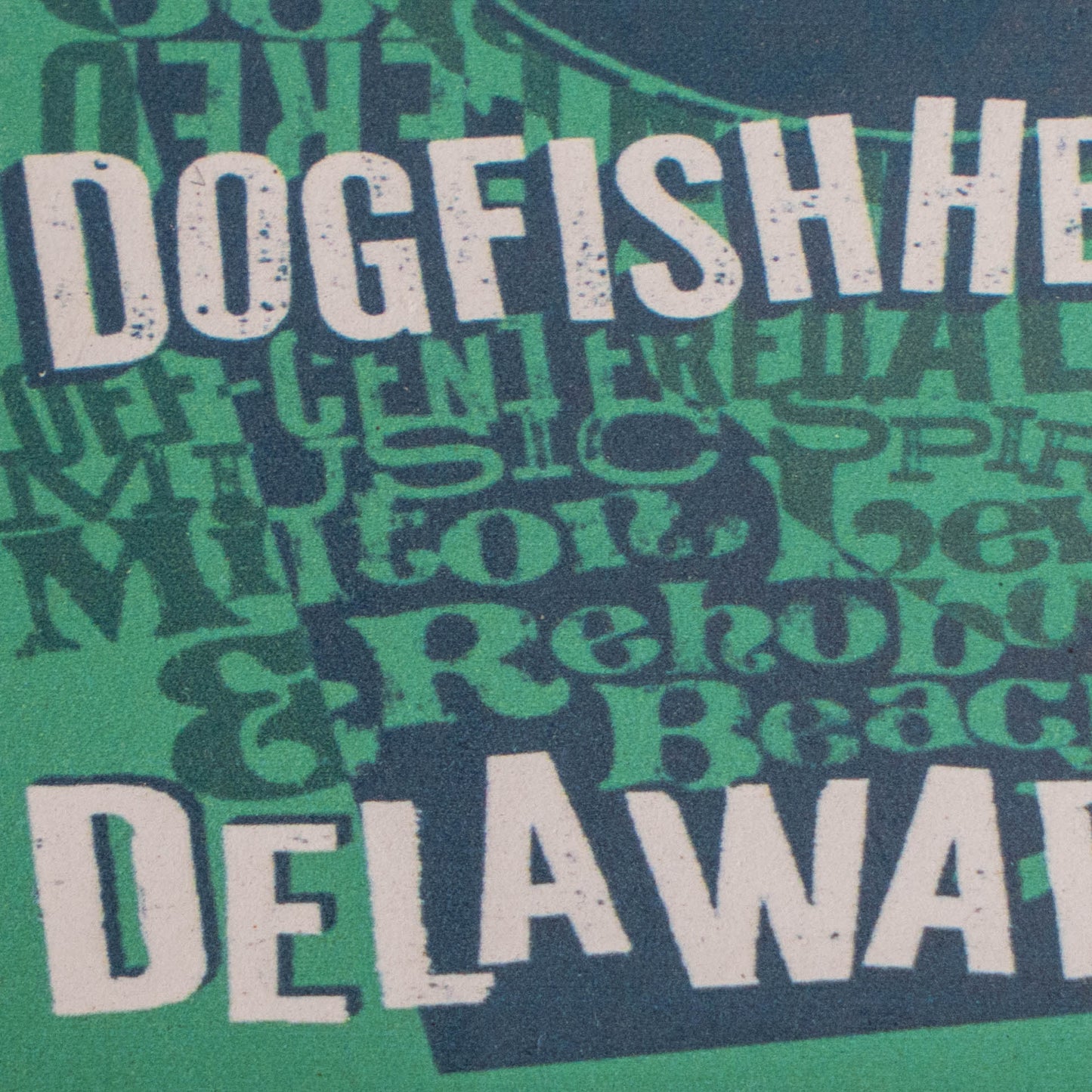 Close-up of a graphic print featuring the words 'DOGFISH '.