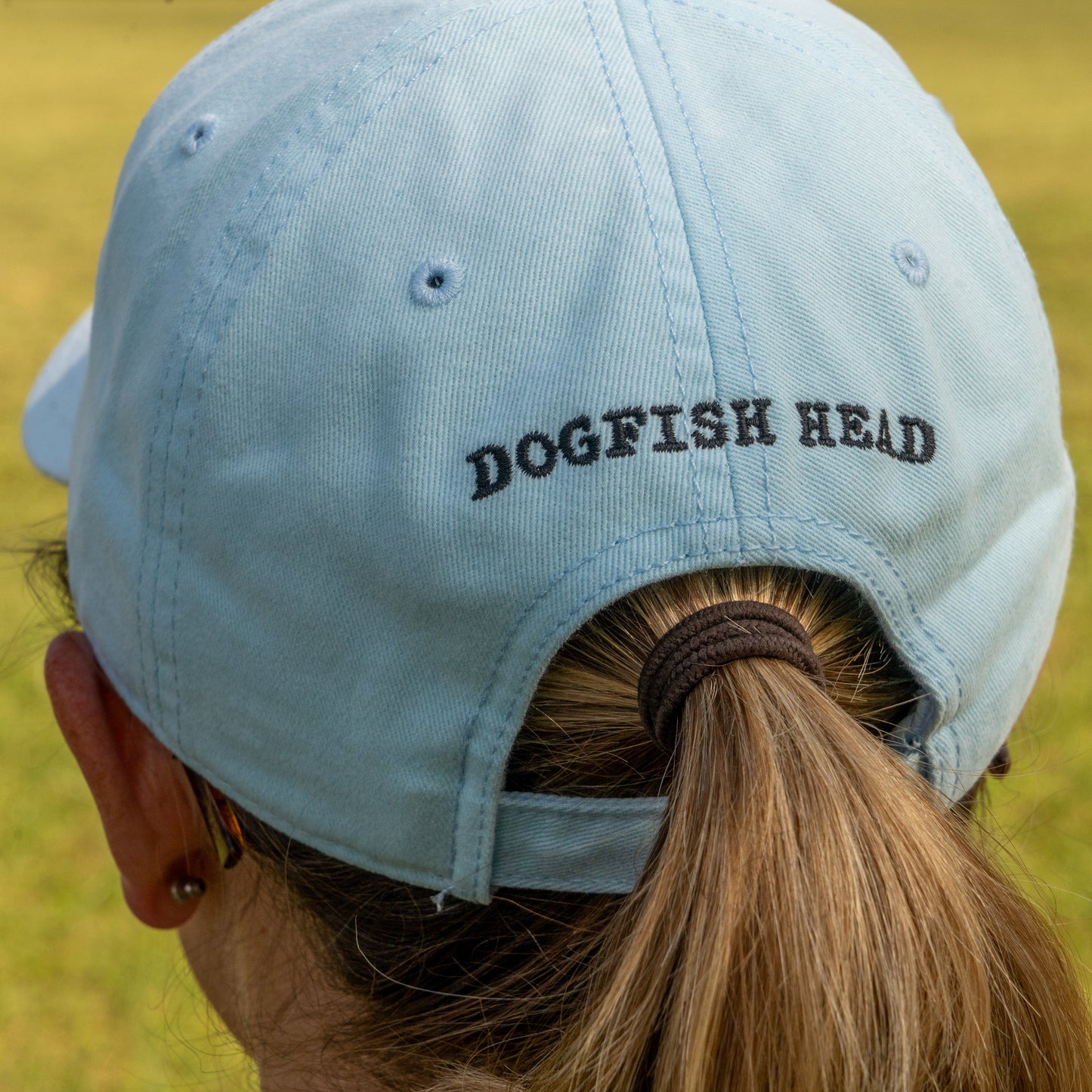 Close-up of the back panel of the hat which features 'Dogfish Head' written over the arch before the strap.