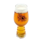 A 19oz glass filled with beer featuring black imagery of underwater designs on the front with writing "Explore Goodness" on it. The other side of the glass features a black Dogfish Head shark and shield logo.