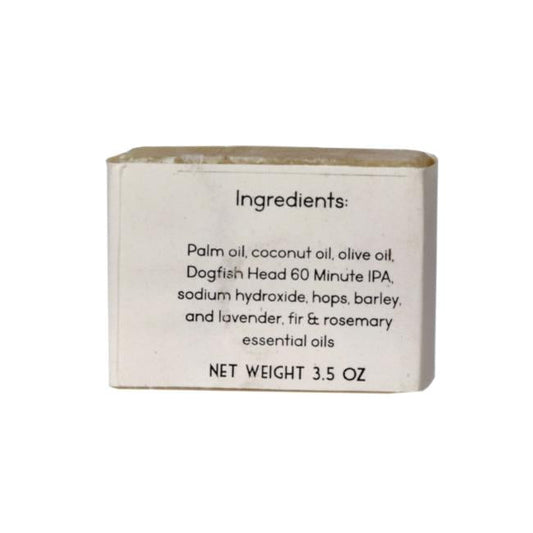 A 3.5 oz bar of Parsonage Handmade Soaps Beer Soap featuring ingredients like palm, coconut, and olive oils, Dogfish Head 60 Minute IPA, hops, barley, sodium hydroxide, plus lavender, fir & rosemary essential oils.