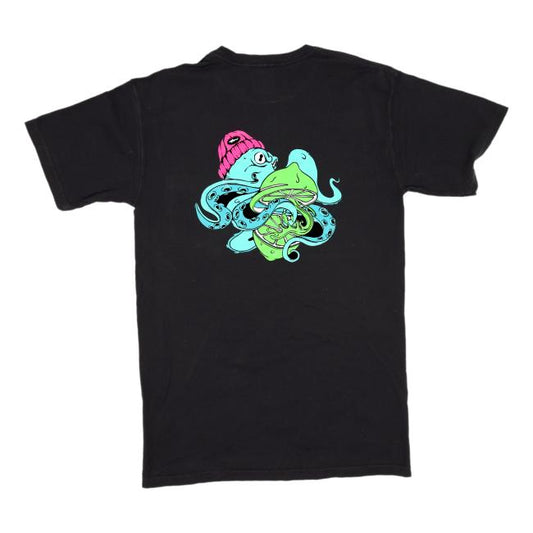 The GO WEST T-SHIRT COMPANY Black Seaquench Short Sleeve Tee is made from 100% ring-spun cotton and features a vibrant cartoon octopus in a pink beanie holding a green fish and yellow object, graphic centered on the back.