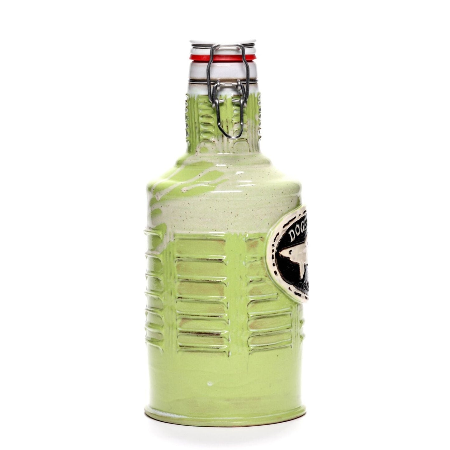 The Citrus Green Ceramic Growler by Romanick Pottery features a glossy, ribbed ceramic body with a metal clasp, red neck accents, and a raised black and white oval emblem on the side.