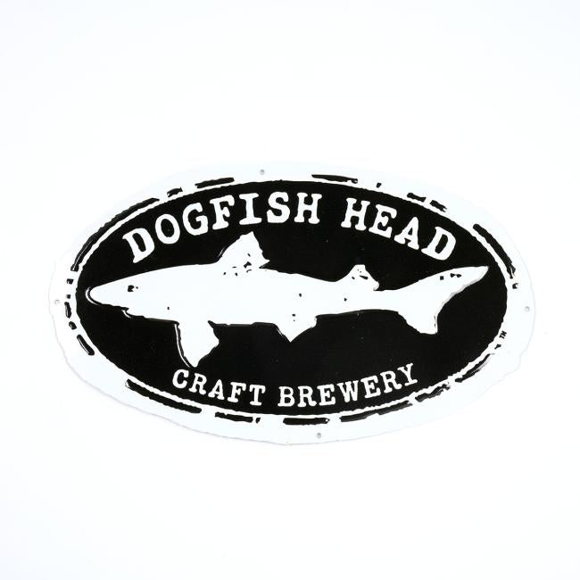 A black and white oval Craft Brewery Tin Tacker from Tintackers.com features a shark silhouette with “DOGFISH HEAD” at the top and “CRAFT BREWERY” at the bottom—ideal for Dogfish Head fans or collectors.