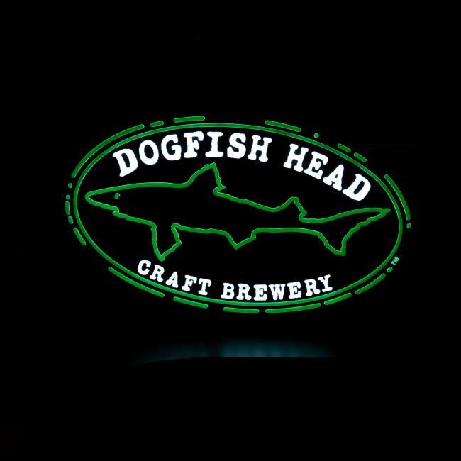 The Merchtank DFH Craft Brewery LED Neon features a green neon shark with an oval border and bold white "DOGFISH HEAD CRAFT BREWERY" letters, creating a durable and eye-catching sign.