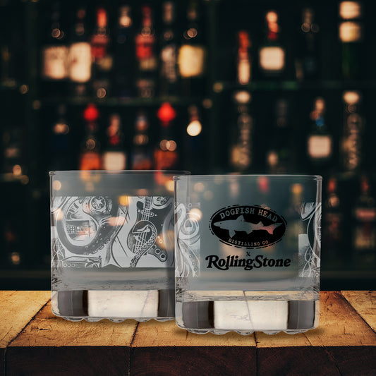 Two clear glasses with Dogfish Head and Rolling Stone logos on a blurred out background