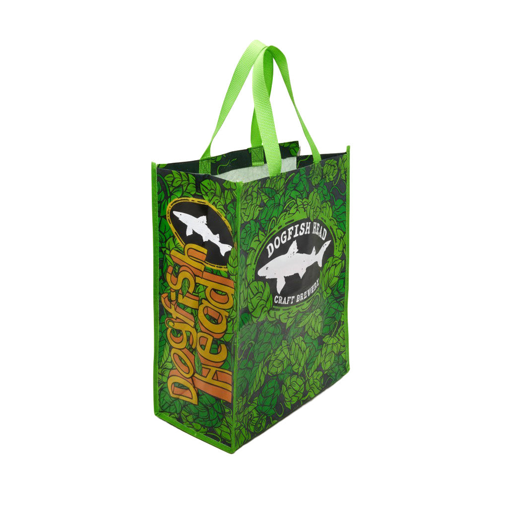 Dogfish Head reusable shopping bag with green leaf pattern, featuring “Dogfish Head Craft Brewery” fish logo and bold “Dogfish Head” lettering on the side, tote with green handles.
