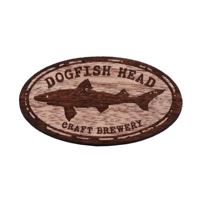 Wood magnet of the Dogfish Head shark and shield logo.