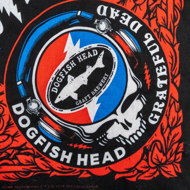 The Merchtank Dogfish Head x Grateful Dead Bandana features a stylized skull in headphones with lightning bolt and fish graphics, plus circular text—an ideal craft beer-themed accessory.