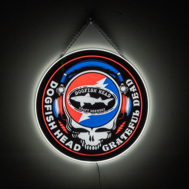 The Firebolt Group Dogfish Head x Grateful Dead LED Sign features a skull with a red and blue lightning bolt in headphones, reading "Dogfish Head Craft Brewery" and "Grateful Dead"—ideal for bar decor.