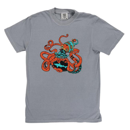 The Granite Kraken Short Sleeve Tee by GO WEST T-SHIRT COMPANY showcases a gray steampunk design with a giant orange cartoon kraken battling a blue-and-black superhero with a yellow bat symbol, tentacles tightly wrapped around the hero.