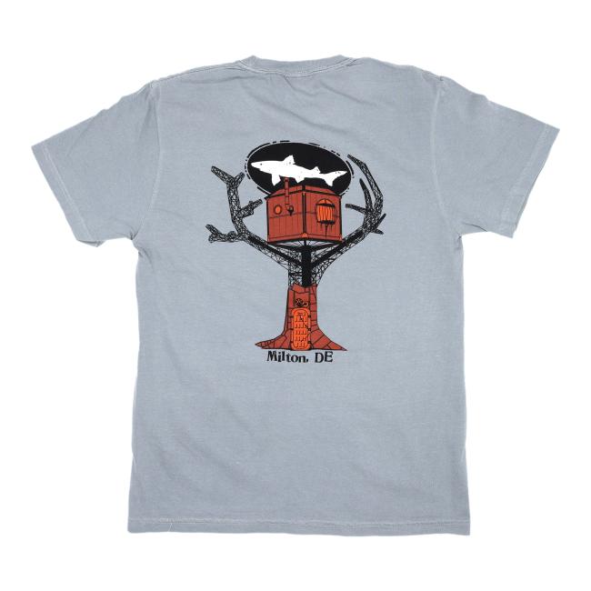 The GO WEST T-SHIRT COMPANY Granite Treehouse Short Sleeve Tee is crafted from soft ring spun cotton and features a red treehouse graphic in a black tree silhouette, a white shark above, and Milton, DE printed below for a true Milton vibe.