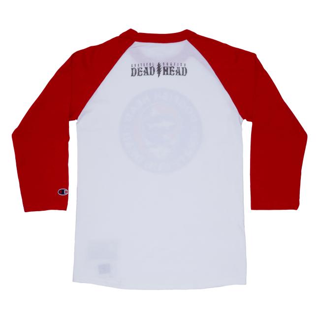 The back of the white tee with red sleeves. Under the neck, "Grateful Dead " and "Dogfish Head" is written with a lightning bolt in between them.