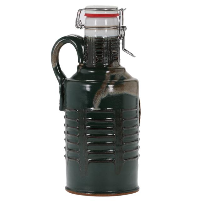 The Hunter Green Ceramic Growler by Romanick Pottery features a handle, ribbed texture, and a flip-top glass lid with metal clasp and red rubber seal—perfect as a handcrafted growler.