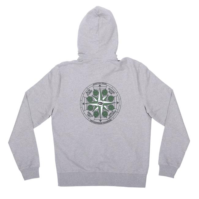 The INN Heather Grey Compass Zip Hoodie by GO WEST T-SHIRT COMPANY is made from organic French Terry cotton. Laid flat, it showcases a circular back graphic with green geometric patterns and black text, inspired by Dogfish Head.