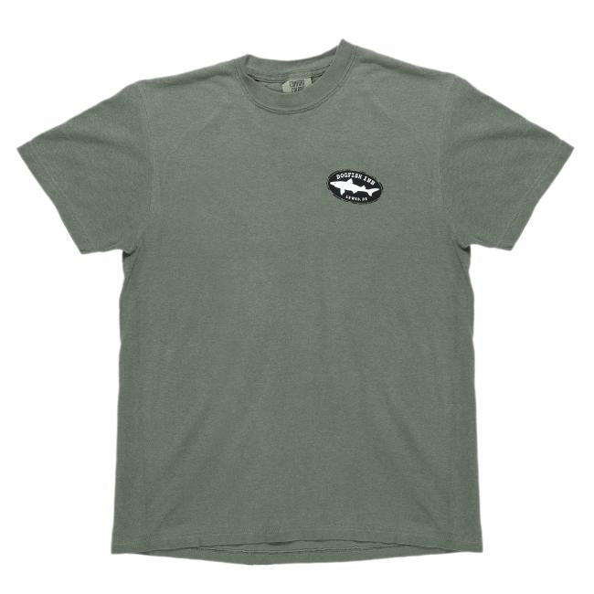 Moss green front of tee features a black Dogfish Head shark and shield logo on the left side of the chest. The logo features writing "Dogfish Inn" "Lewes, DE" on it.