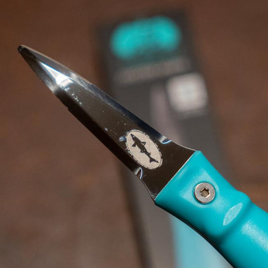 Blue oyster knife features the Dogfish Head shark and shield logo engraved on one side of the knife. The other side of the knife features the Toadfish logo engraved. 