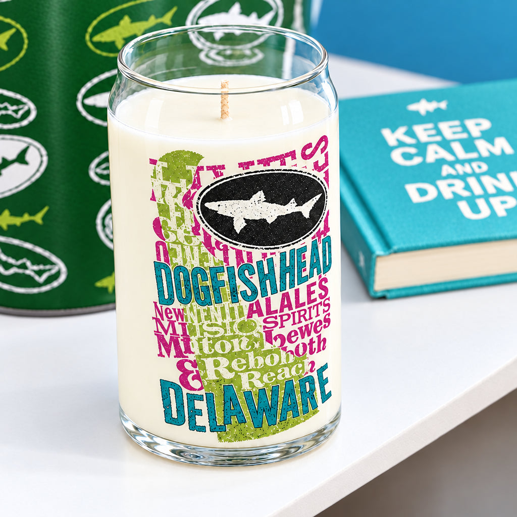 Can glass candle sitting on table.  Glass has various text on it.