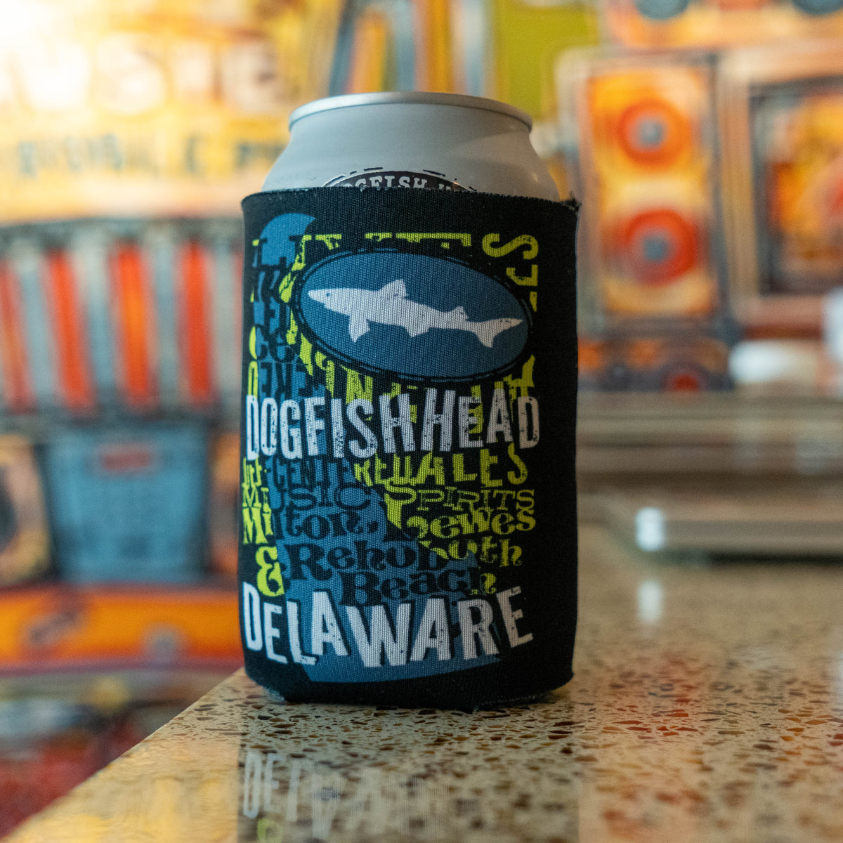 Can Cooler holding can of Dogfish Head Beer with the state of Delaware on the front.