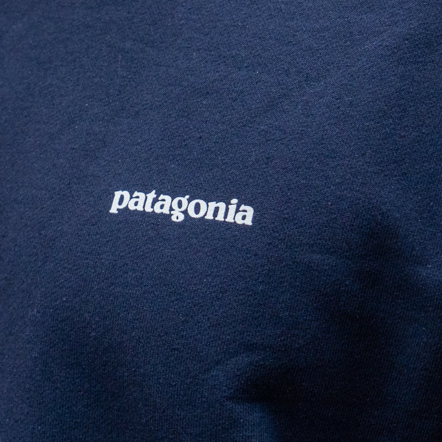 Navy blue fabric with 'patagonia' logo in white
