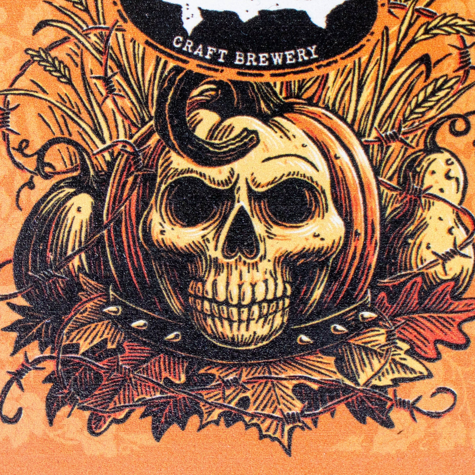 A Halloween-themed graphic illustration featuring a central skull wearing a pumpkin hat, surrounded by pumpkins, autumn leaves, and barbed wire on an orange background. A black oval at the top reads 'CRAFT BREWERY'.
