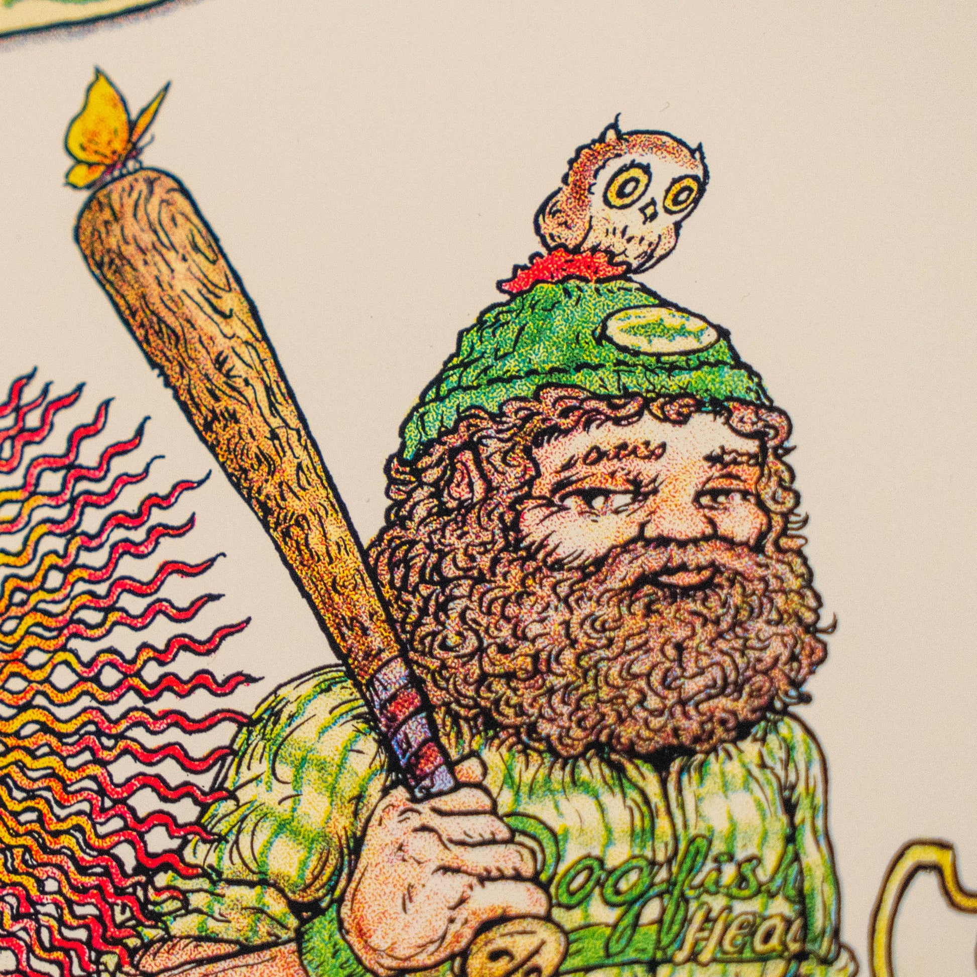 A bearded man in a green hat with a small owl perched on top holds a wooden bat adorned with a butterfly, while his shirt reads “Dogfish Head.” This colorful and whimsical scene is beautifully captured in the League Champions Limited-Edition Print by Marq Spusta—a delightful collectible for any fan of Marq Spusta’s artwork.