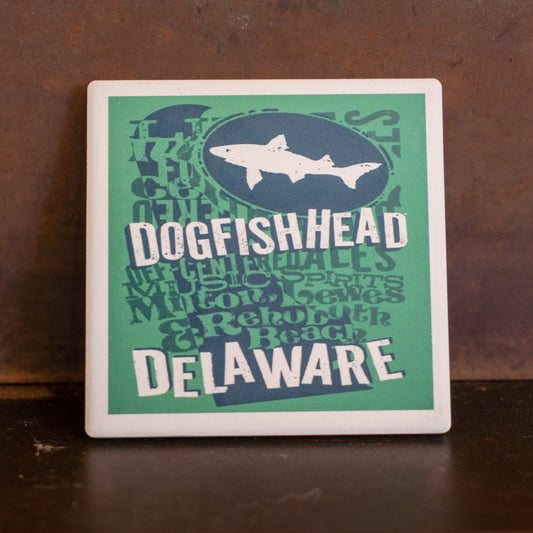 Introducing the Teal Delaware Ceramic Coaster by Paint the Town, Inc.—a rectangular accessory featuring a bold teal background with striking blue and white text that proudly showcases “Delaware” and your state pride. This eye-catching piece is an ideal addition for craft beer lovers or anyone seeking a stylish tribute to Delaware’s vibrant culture.