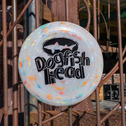 Grey frisbee with tie dye accents and a black Dogfish Head logo with "Dogfish Head" styled in 3-d block text.