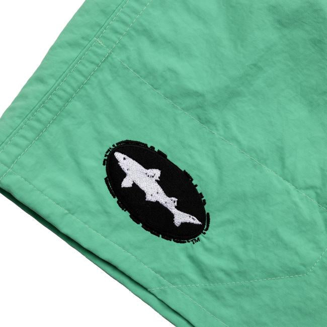 Patagonia Green Baggies Long Shorts feature recycled nylon and a black oval patch with a white shark silhouette, from the Dogfish Head x Patagonia collaboration.