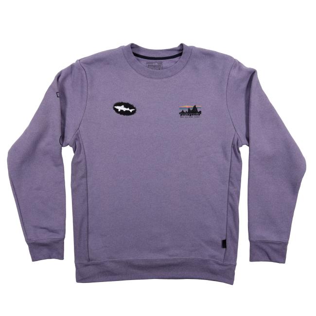 The Patagonia Purple Uprisal Crew Sweatshirt is a heavyweight recycled cotton crew with ribbed cuffs and hem, plus two small chest patches—one oval-shaped, the other a scenic landscape with trees and mountains.