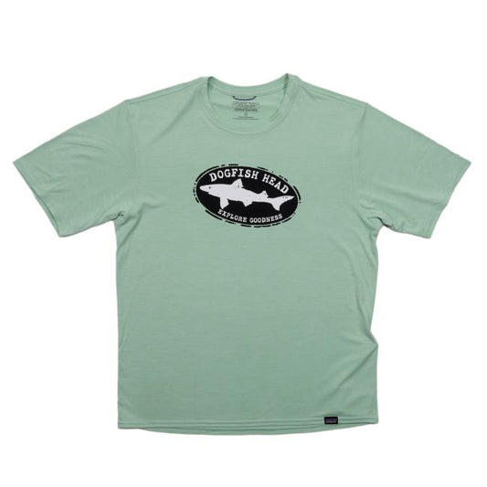 The Patagonia Teal Short Sleeve Runner is a moisture-wicking tee featuring a black oval logo with white dogfish silhouette and Dogfish Head Explore Goodness text, designed for all-day comfort.