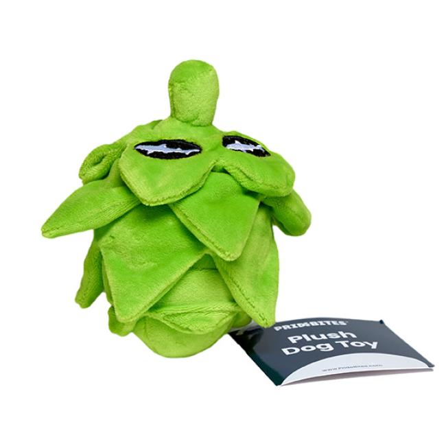 The Plush Hop Dog Toy by PrideBites is a green plush dog toy shaped like a hop cone with cartoon eyes, a durable squeaker, and a “Plush Dog Toy” tag.