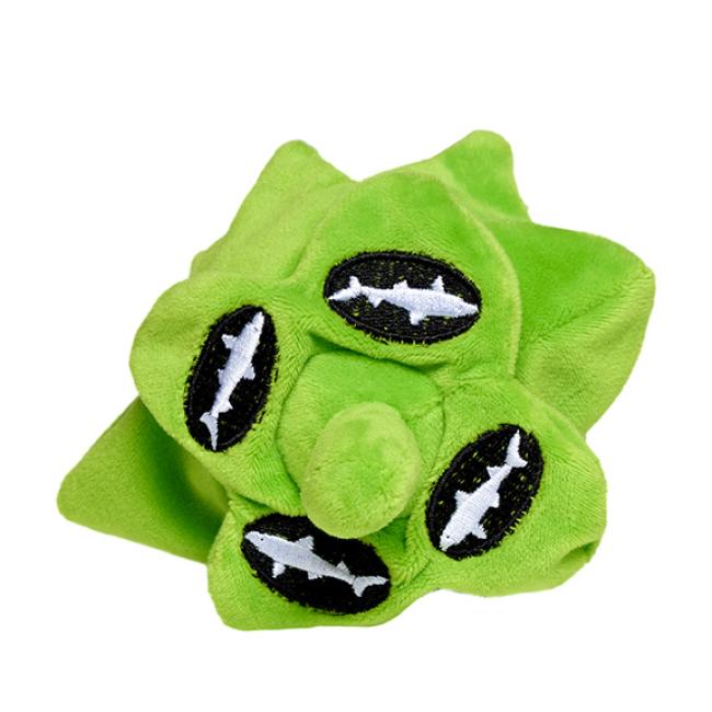 The PrideBites Plush Hop Dog Toy is a green plush dog toy with three black oval patches showing white shark silhouettes, a central round protrusion, and a durable squeaker, all styled playfully like a germ or virus.