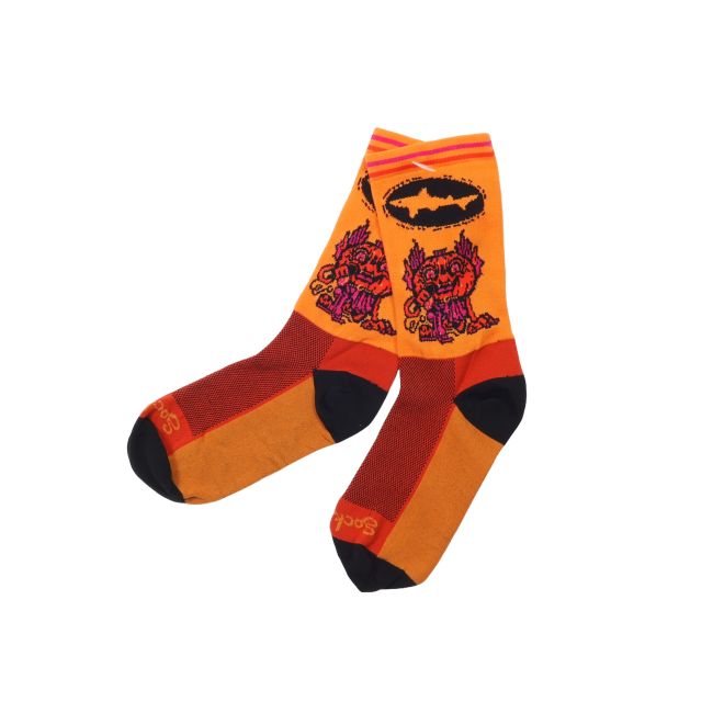 Orange socks that are black at the toes and the heel. This year's Punkin artwork is featured on the body of the sock and the Dogfish Head shark and shield logo in black is right above it.
