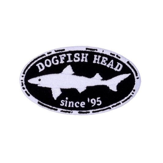 The Since '95 Patch by Mirror Image Inc. is an oval embroidered patch with a white dogfish shark silhouette and "DOGFISH HEAD since 95" text on a black background, featuring the iconic Shark & Shield logo.