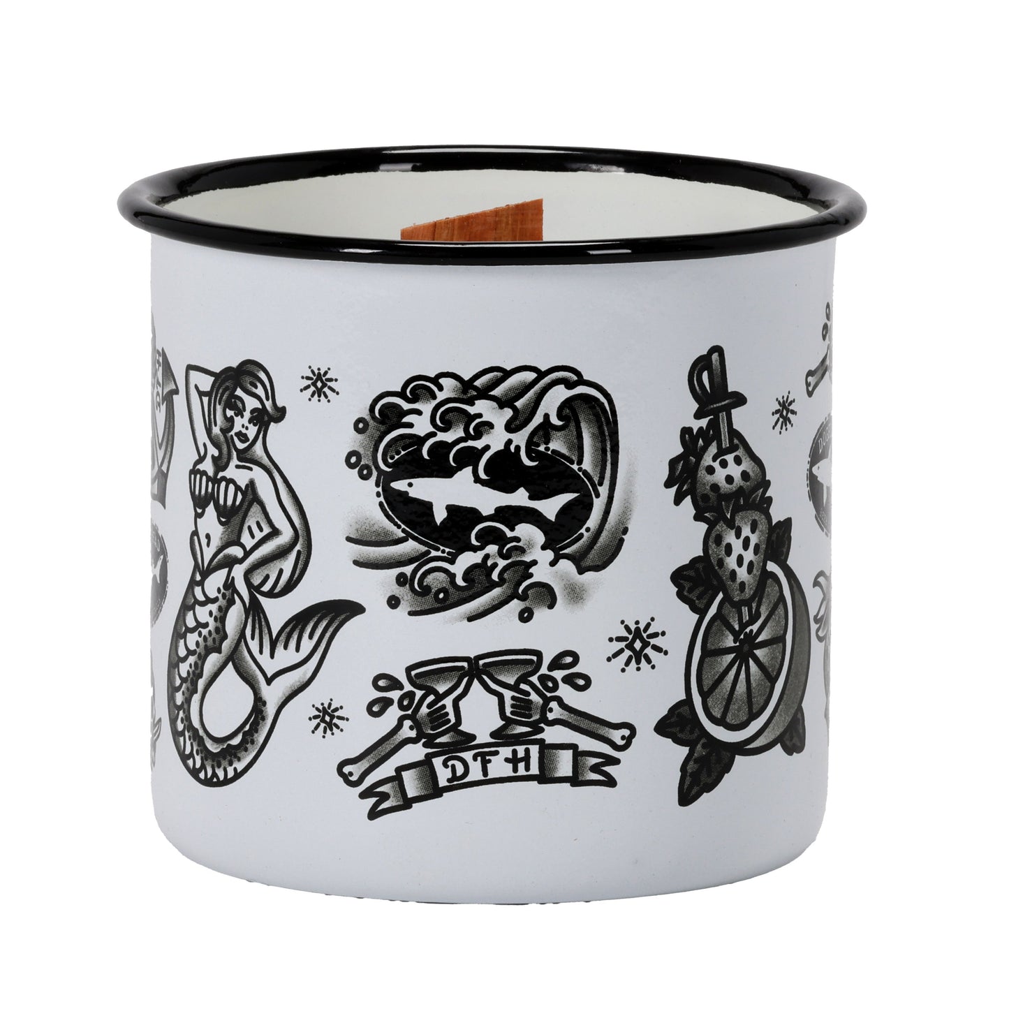 The Tattoo Enamel Mug Candle by Unwined Candles, LLC is a white camping mug with black, tattoo-style mermaid, wave, fruit skewer designs and a DFH ribbon. It features a wooden wick and is reusable as a mug after the candle is used.