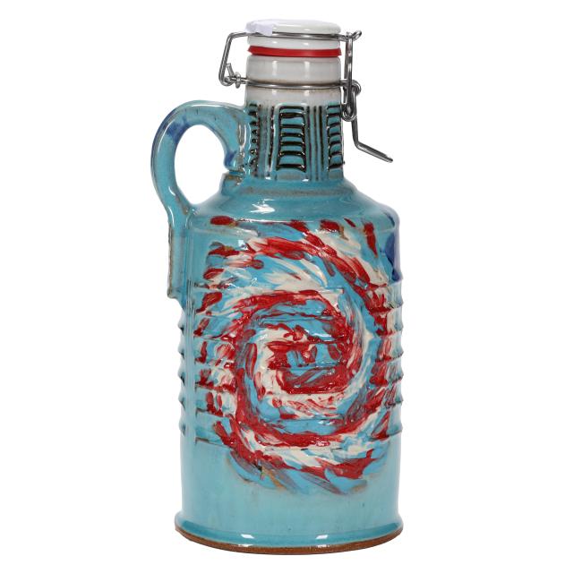 The Romanick Pottery Tie Dye Ceramic Growler features a handcrafted ceramic build with a handle, metal clasp lid, turquoise blue glaze, and a red, white, and blue spiral tie-dye pattern on the front.