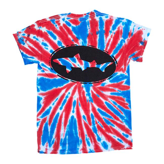 The GO WEST T-SHIRT COMPANY Tie Dye Logo Short Sleeve Tee is a unisex shirt with red, blue, and white spirals. It features a bold black oval logo with a shark silhouette on the back for standout style.