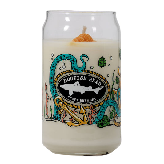 The Under the Sea Can Glass Candle by Unwined Candles, LLC is a white candle shaped like a beer can, with colorful underwater art and ocean scent. It features an orange seashell wick.
