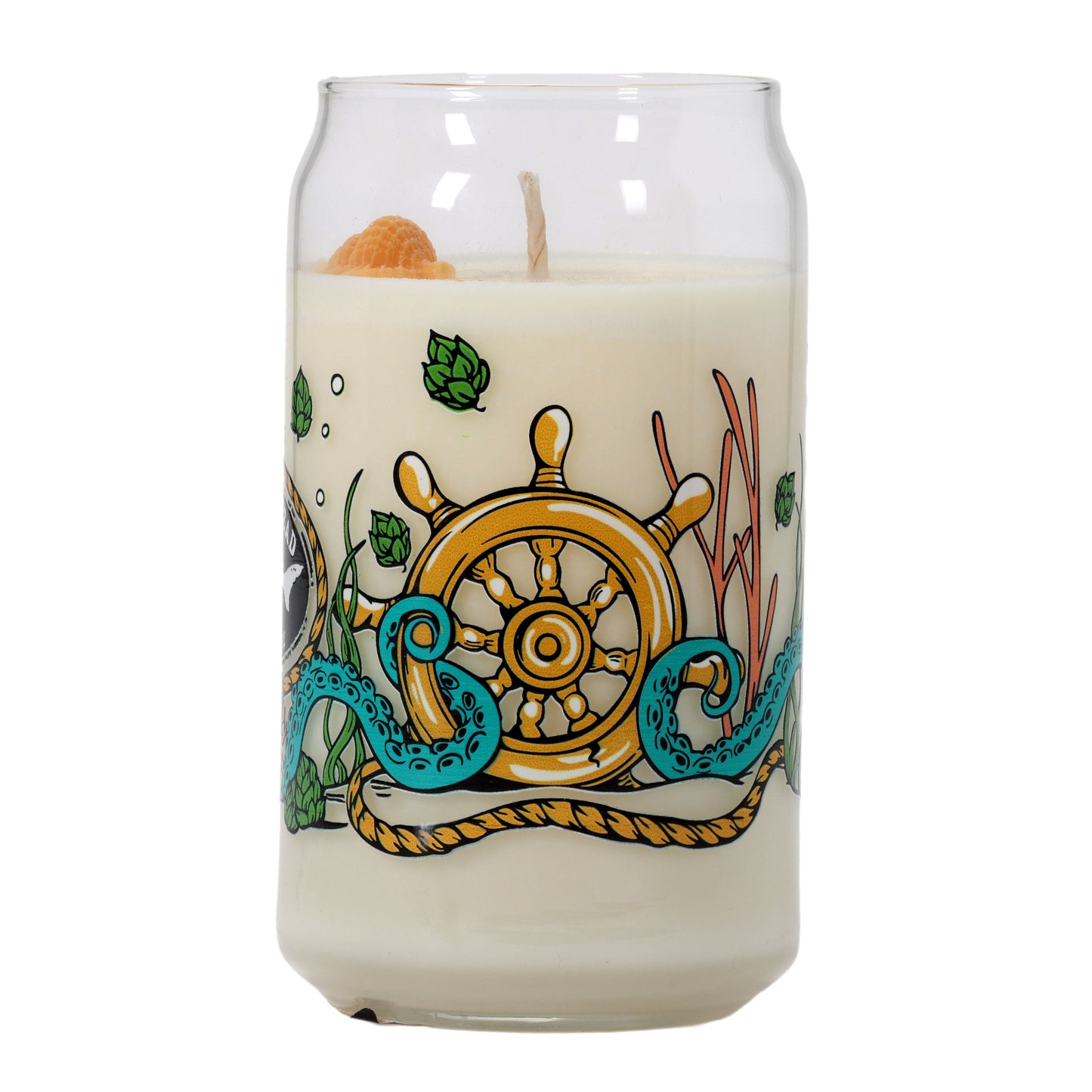 The Under the Sea Can Glass Candle by Unwined Candles, LLC is shaped like a soda can and features nautical art with a ship’s wheel, green hops, orange slices, and blue octopus tentacles—ideal for adding ocean vibes to any space.