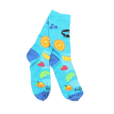Pair of bright blue Dogfish Head socks with colorful fruit designs including orange slices, lemon wedges, strawberries, mangoes, and blueberries, with darker blue heels and toes.