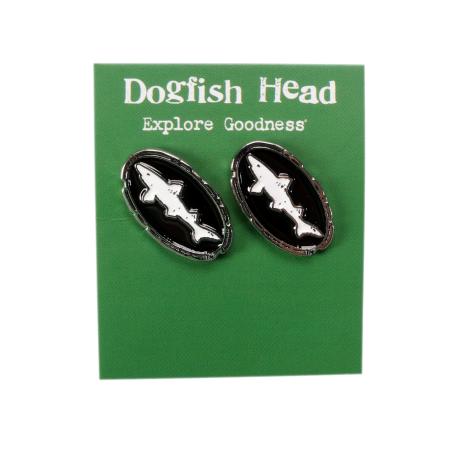 Black and white shark and shield earrings shown on green packaging.