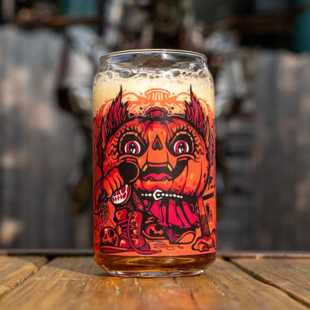 Image of front of can glass features orange red Punkin artwork.