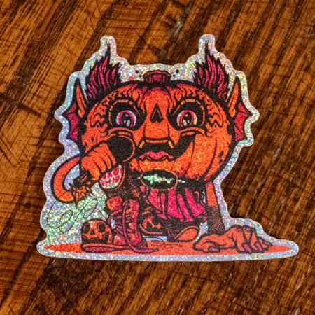 Sticker features orange/red Punkin artwork with a mic in its hand. Sticker is outlined with glitter.