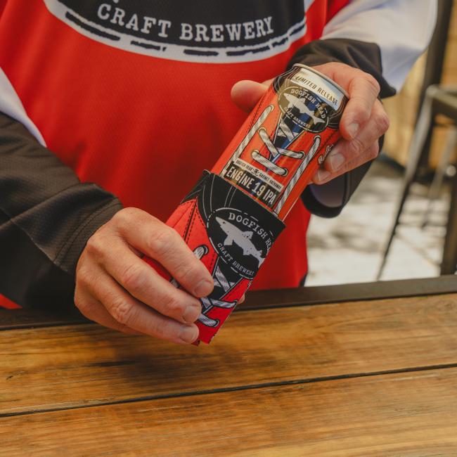 Image of a person pulling out a limited-edition Engine 19 can out of the can cooler.