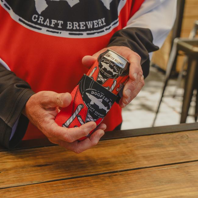 Image of a person pulling out a limited-edition Engine 19 can out of the can cooler.