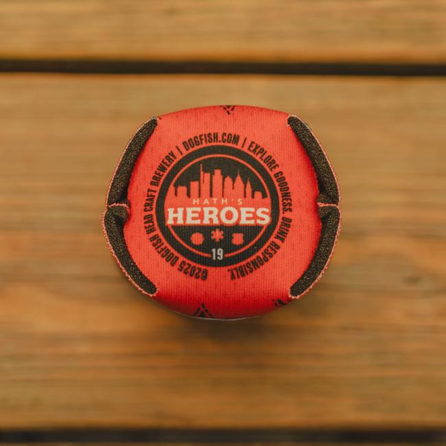 Bottom of can cooler features emblem with skyline in the middle and writing