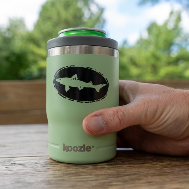 Dogfish Head 12oz sage green can cooler shown with its lid and screw-on ring removed, highlighting its dual function as a tumbler or can insulator, shown with a can in it.