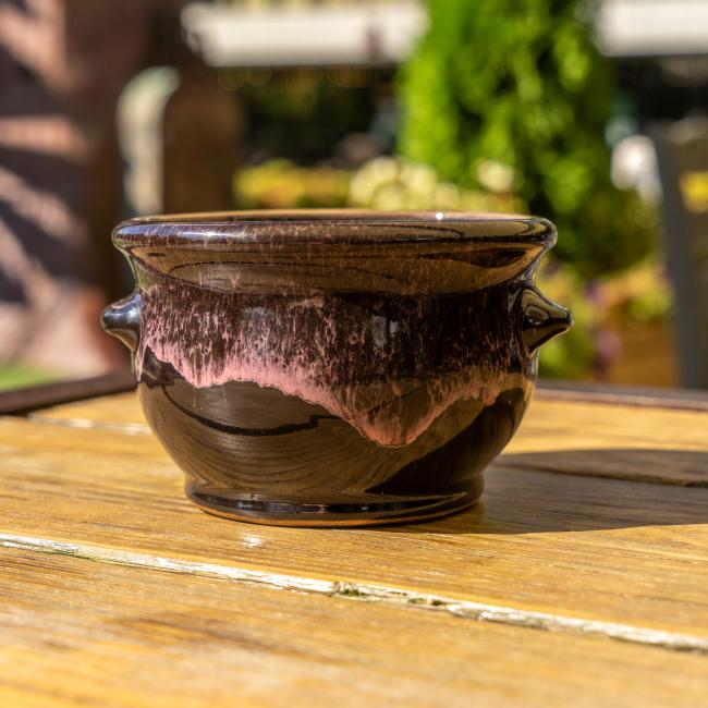 Back view of black crock.
