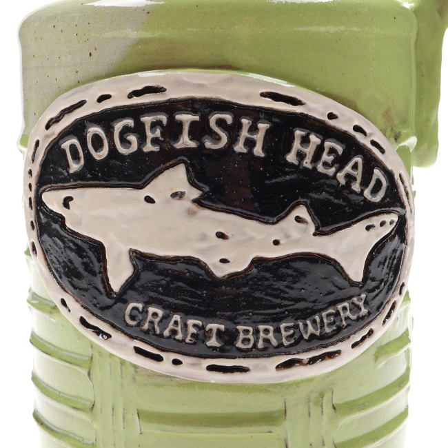 Close-up of the Dogfish Head logo displayed on the front of the growler.