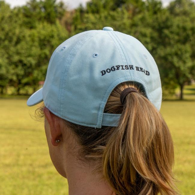 Close-up of the back panel of the hat which features 'Dogfish Head' written over the arch before the strap.